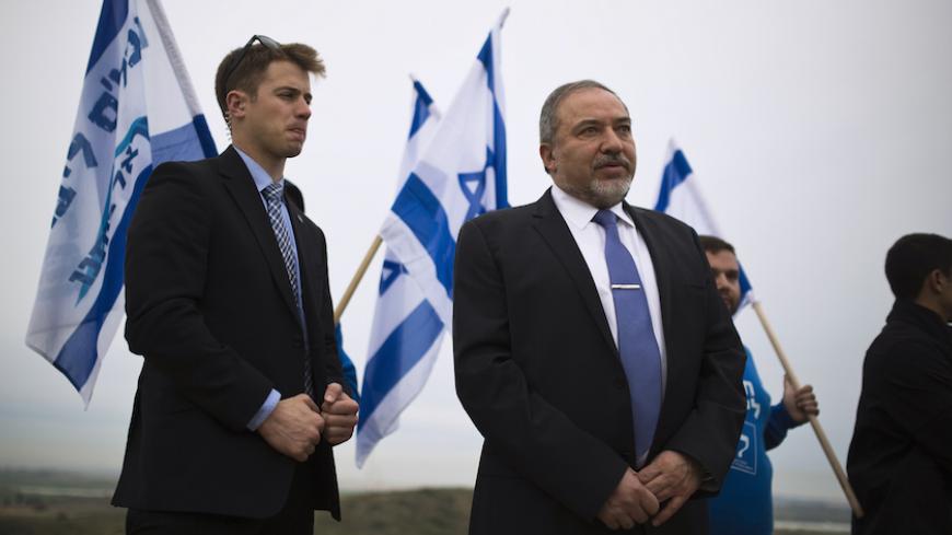 Israel's Foreign Minister and head of Yisrael Beitenu party Avigdor Lieberman stands on a hill overlooking the Gaza Strip, as he campaigns in the southern town of Sderot February 23, 2015. REUTERS/Amir Cohen (ISRAEL - Tags: POLITICS ELECTIONS) - RTR4QSP0