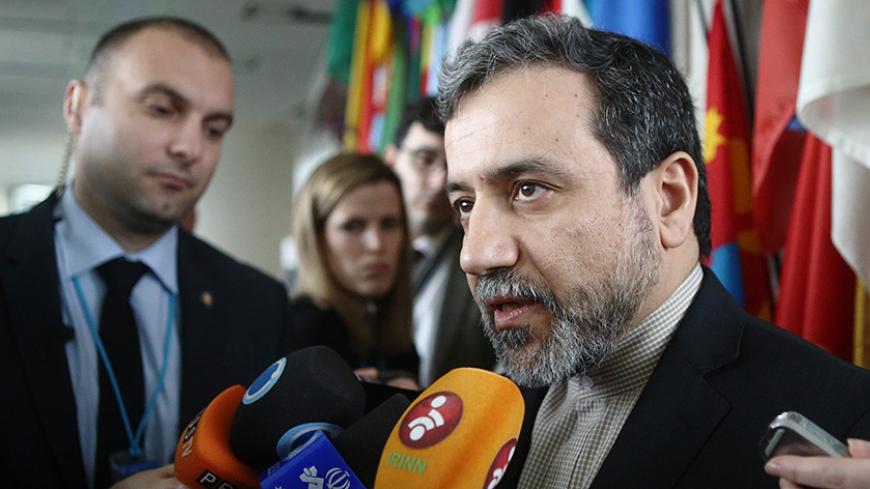 Iran's chief nuclear negotiator Abbas Araghchi talks to the media after meeting IAEA Director General Yukiya Amano (not pictured) at the IAEA headquarters in Vienna February 24, 2015. REUTERS/Heinz-Peter Bader  (AUSTRIA) - RTR4QX5Z