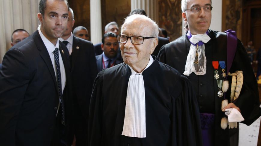 Tunisian President Beji Caid Essebsi (C) arrives to attend a ceremony at the Sorbonne University in Paris, France, 07 April 2015. Tunisian President Beji Caid Essebsi starts a state visit to France in the wake of attacks in Tunis and Paris. REUTERS/Yoan Valat/Pool - RTR4WEYK