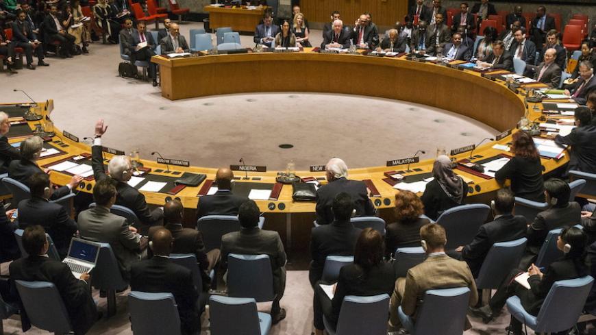 The Russian ambassador to the United Nations Vitaly Churkin abstains from a vote in the United Nations Security Council attempting to halt the escalating conflict in Yemen in New York April 14, 2015. The United Nations Security Council on Tuesday imposed an arms embargo targeting the Iran-allied Houthi rebels who rule most of the country and blacklisted the son of Yemen's former president and a Houthi leader after veto-power Russia abstained.  REUTERS/Lucas Jackson      TPX IMAGES OF THE DAY      - RTR4XBCA