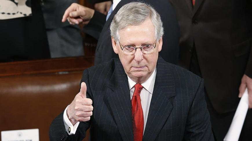 U.S. Senate Majority Leader Mitch McConnell (R-KY) gestures to to a colleague before the start of
 Japanese Prime Minister Shinzo Abe's address a joint meeting of the U.S. Congress on Capitol Hill in Washington, April 29, 2015. McConnell and Abe were scheduled to meet later in the day.  REUTERS/Jonathan Ernst - RTX1AUYN