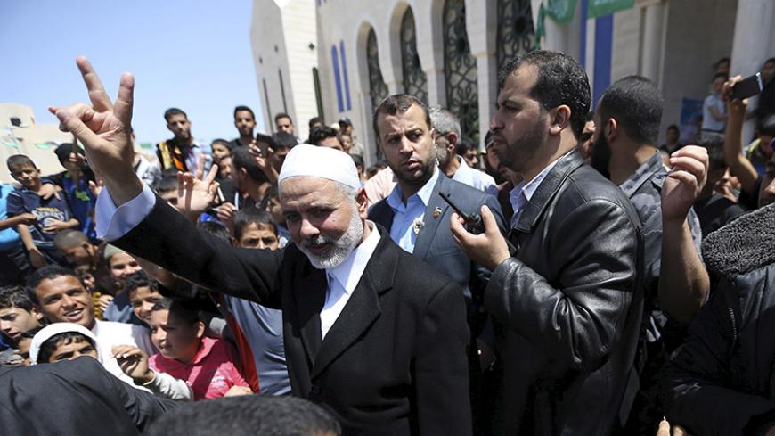 Senior Hamas leader Ismail Haniyeh waves to people after attending Friday prayers at Tebah mosque in Rafah in the southern Gaza Strip May 1, 2015. REUTERS/Ibraheem Abu Mustafa - RTX1B4H7