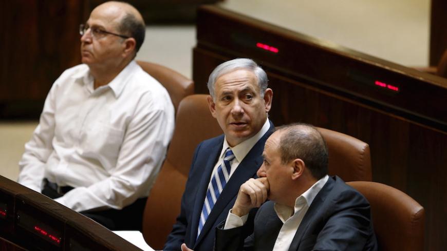 Israel's Prime Minister Benjamin Netanyahu (C), Defence Minister Moshe Yaalon (L), and Energy and Water Minister Silvan Shalom attend a session of parliament in Jerusalem May 4, 2015. Israeli Foreign Minister Avigdor Lieberman said on Monday he would not join the new coalition government being formed by Netanyahu, citing disputes over legislation. REUTERS/Ronen Zvulun  - RTX1BHVV
