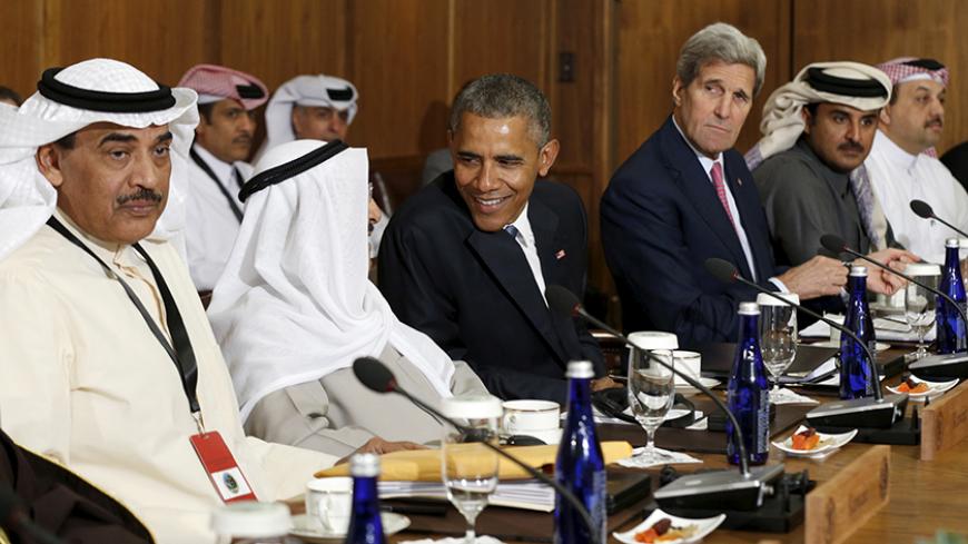 U.S. President Barack Obama hosts a working session of the six-nation Gulf Cooperation Council (GCC) at Camp David in Maryland May 14, 2015. Flanking Obama are U.S. Secretary of State John Kerry (R) and Sheikh Sabah Al-Ahmed Al-Jaber Al-Sabah (L)  the Emir of Kuwait. Obama will seek to convince Saudi Arabia and other Gulf allies on Thursday that the United States is committed to their security despite deep concern among Arab leaders about U.S. efforts to broker a nuclear deal with Iran.   REUTERS/Kevin Lama