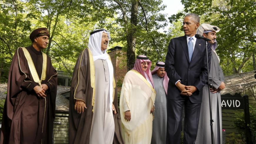 U.S. President Barack Obama looks back toward Oman Deputy Prime Minister Sayyid Fahd bin Mahmoud Al Said (L) and the Emir of Kuwait Sheikh Sabah Al-Ahmed Al-Jaber Al-Sabah (2nd L) while hosting the six-nation Gulf Cooperation Council (GCC) at Camp David in Maryland May 14, 2015.    REUTERS/Kevin Lamarque   - RTX1D0ZQ