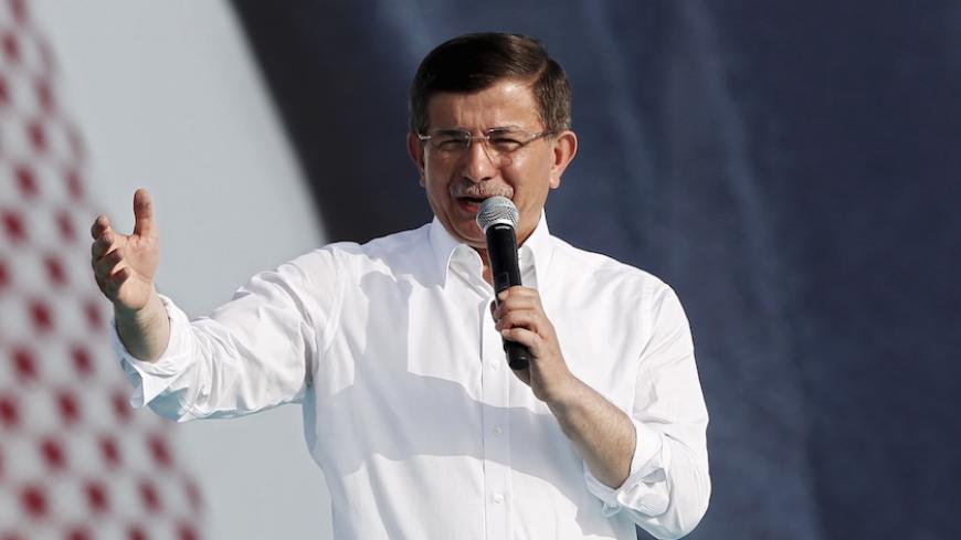 Turkish Prime Minister Ahmet Davutoglu addresses AK Party' supporters during an election rally for Turkey's June 7 parliamentary elections in Istanbul, Turkey, May 17, 2015.   REUTERS/Osman Orsal - RTX1DC5K