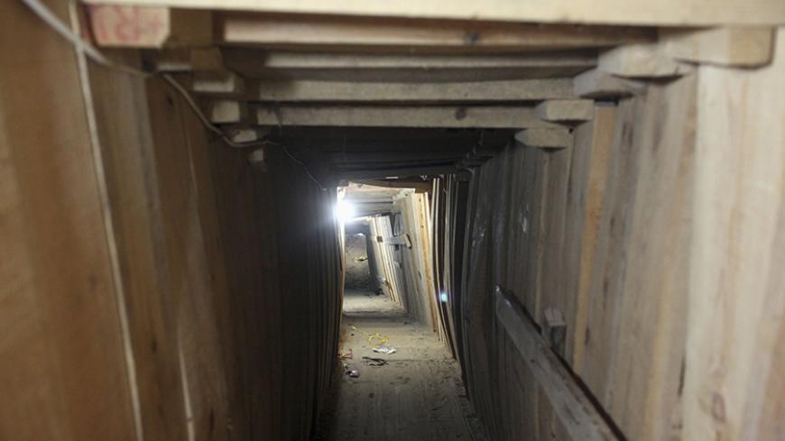 A working tunnel, which is used to smuggle people from Egypt to Gaza, is seen in the Egyptian border city of Rafah, May 13, 2013. REUTERS/Asmaa Waguih (EGYPT - Tags: POLITICS CONFLICT) - RTXZLC7