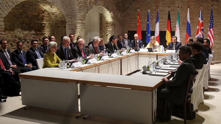 Negotiators of Iran and six world powers face each other at a table in the historic basement of Palais Coburg hotel in Vienna April 24, 2015. Nuclear talks are making good but slow progress as they work towards a June 30 deadline for a final deal, Tehran's senior negotiator Abbas Araqchi said on Friday. REUTERS/Heinz-Peter Bader - RTX1A5EA