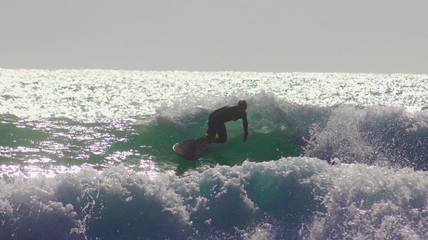 Surfer Catches A Wave in Jiyeh, Lebanon