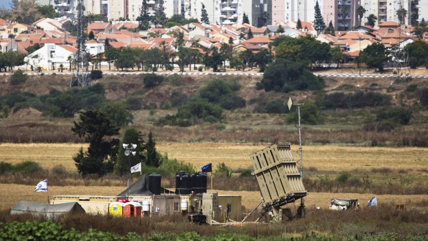 A recently located Iron Dome battary can be seen near the southern Israeli city of Ashkelon  outside the Gaza Strip June 7, 2015. Israeli aircraft struck the Northern Gaza Strip on Sunday and Israel closed the border crossing with the Hamas-controlled territory after a rocket attack on Saturday claimed by the Omar Brigades, a Palestinian group that supports Islamic State. REUTERS/Amir Cohen  - RTX1FHS4