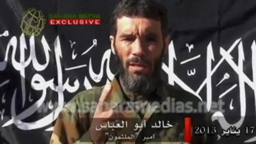 Veteran jihadist Mokhtar Belmokhtar speaks in this undated still image taken from a video released by Sahara Media on January 21, 2013. Belmokhtar has claimed responsibility in the name of al Qaeda for the Algerian hostage-taking, and his Mulathameen Brigade warned it would carry out further attacks on foreign interests unless the fighting in Mali stopped Mauritanian news website Sahara Media said on January 20. REUTERS/Sahara Media via Reuters TV  (ALGERIA - Tags: CIVIL UNREST CONFLICT TPX IMAGES OF THE DA