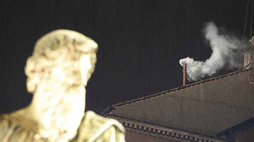 White smoke rises from the chimney above the Sistine Chapel in the Vatican, indicating a new pope has been elected at the Vatican March 13, 2013. White smoke rose from the Sistine Chapel and the bells of St. Peter's Basilica rang out on Wednesday, signaling that Roman Catholic cardinals elected a pope to succeed Benedict XVI. REUTERS/Tony Gentile (VATICAN  - Tags: RELIGION)   - RTR3EXR7