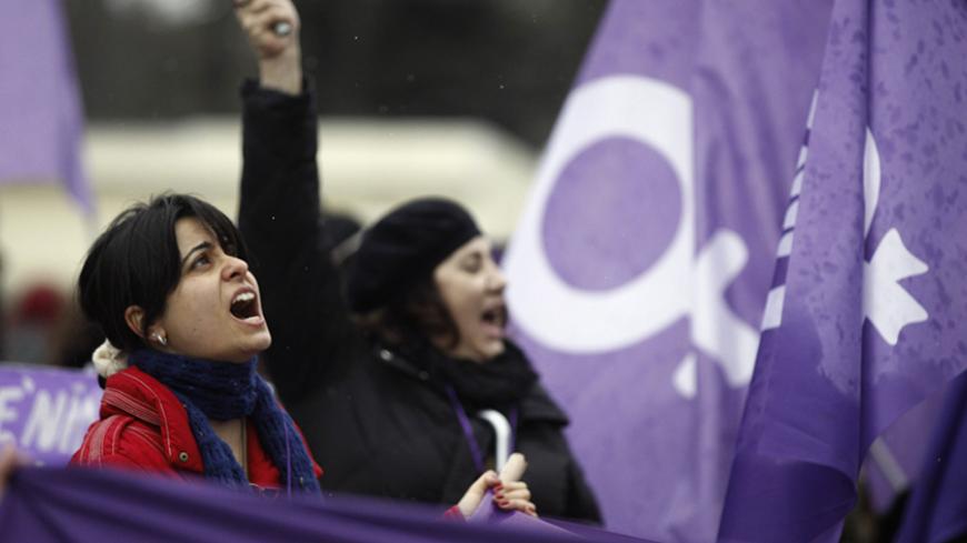 Women protest against the government and violence against women, a day after International Women's Day in Istanbul March 9, 2014. On March 8 activists around the globe celebrate International Women's Day, which dates back to the beginning of the 20th Century and has been observed by the United Nations since 1975. The UN writes that it is an occasion to commemorate achievements in women's rights and to call for further change. REUTERS/Osman Orsal (TURKEY - Tags: POLITICS CIVIL UNREST) - RTR3GB8T