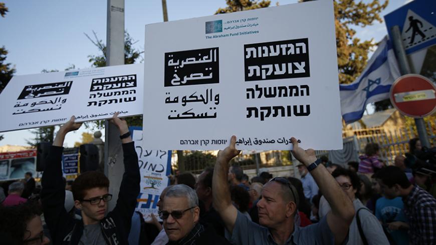 Christians, Muslims and Jews take part in a protest in Jerusalem, against attacks by suspected far-right Israelis, dubbed "price tagging", May 11, 2014. The top Roman Catholic cleric in the Holy Land said on Sunday a spate of attacks he described as acts of terror against the church were poisoning the atmosphere ahead of this month's visit by Pope Francis, and urged Israel to arrest more perpetrators. REUTERS/Ronen Zvulun (JERUSALEM - Tags: POLITICS RELIGION CIVIL UNREST) - RTR3OOUL