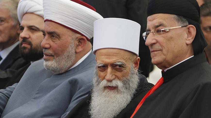 Maronite Patriarch Beshara al-Rai (R) sits beside other religious clerics in a celebration to solidify the reconciliation between Christians and Druze in Brih May 17, 2014. 
REUTERS/Mohamed Azakir  (LEBANON - Tags: POLITICS RELIGION) - RTR3PLU5