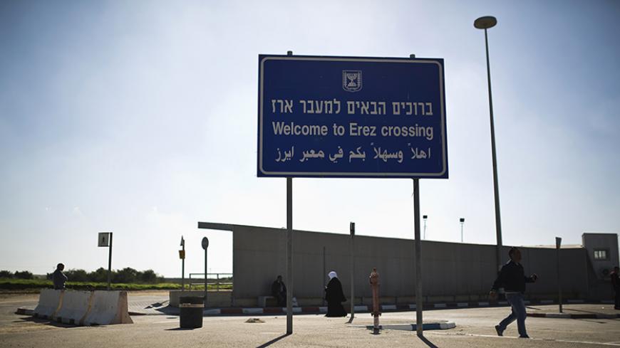 A sign is seen at the Erez border crossing between Israel and northern Gaza Strip December 28, 2014. Hamas authorities in the Gaza Strip prevented on Sunday a group of Palestinian children who lost parents in the July-August war with Israel from making a rare goodwill visit to the Jewish state, organisers of the trip said. REUTERS/Amir Cohen (ISRAEL - Tags: POLITICS CIVIL UNREST) - RTR4JF9V