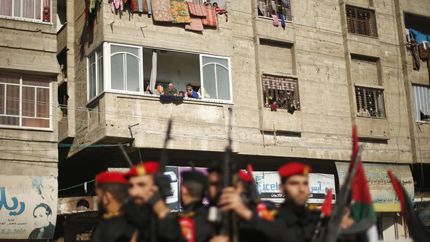 Members of Palestinian security forces loyal to Hamas take part in a parade marking the sixth anniversary of the death of former Hamas interior minister Saeed Seyam, in Gaza City January 18, 2015. Seyam was killed by an Israeli air strike during the three-week offensive Israel launched in 2008 and 2009. REUTERS/Suhaib Salem (GAZA - Tags: POLITICS MILITARY ANNIVERSARY TPX IMAGES OF THE DAY) - RTR4LUNJ