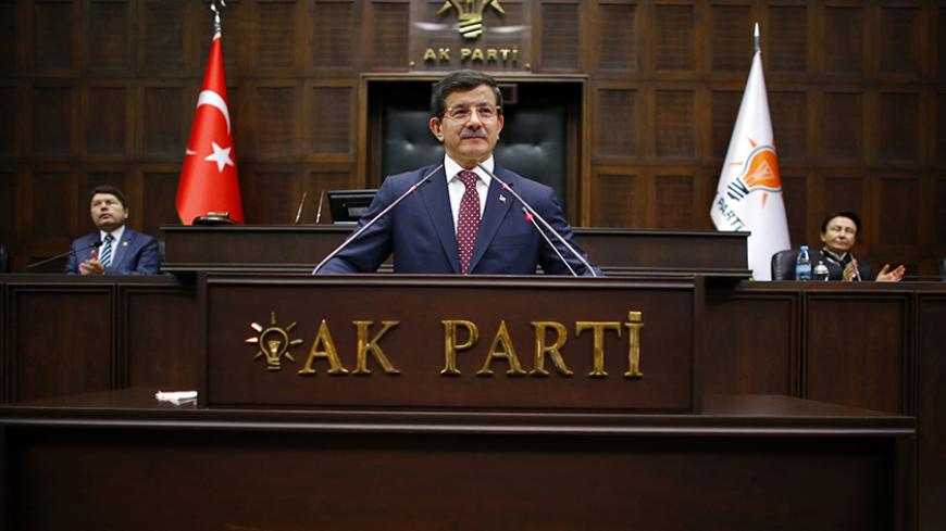 Turkey's Prime Minister Ahmet Davutoglu addresses members of parliament from his ruling AK Party (AKP) during a meeting at the Turkish parliament in Ankara March 2, 2015. REUTERS/Umit Bektas (TURKEY - Tags: POLITICS) - RTR4RQ92