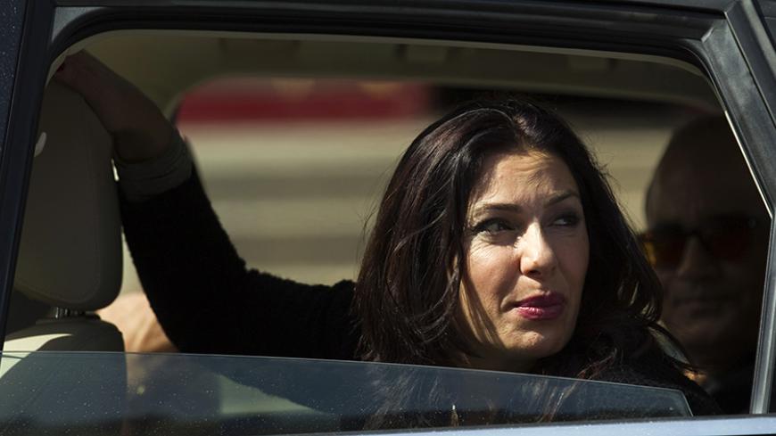 Likud legislator Miri Regev, a former brigadier general and political hardliner of Moroccan origin, looks out a car window during a campaign stop in Netanya, north of Tel Aviv February 25, 2015. Israel's Sephardic community, Jews of Middle Eastern descent, have traditionally been the Likud party's backbone. But political analysts say Sephardim, disproportionately poorer than Israel's Ashkenazi Jews with roots in Europe, may throw their support elsewhere in the March 17 election, angry over the high cost of 