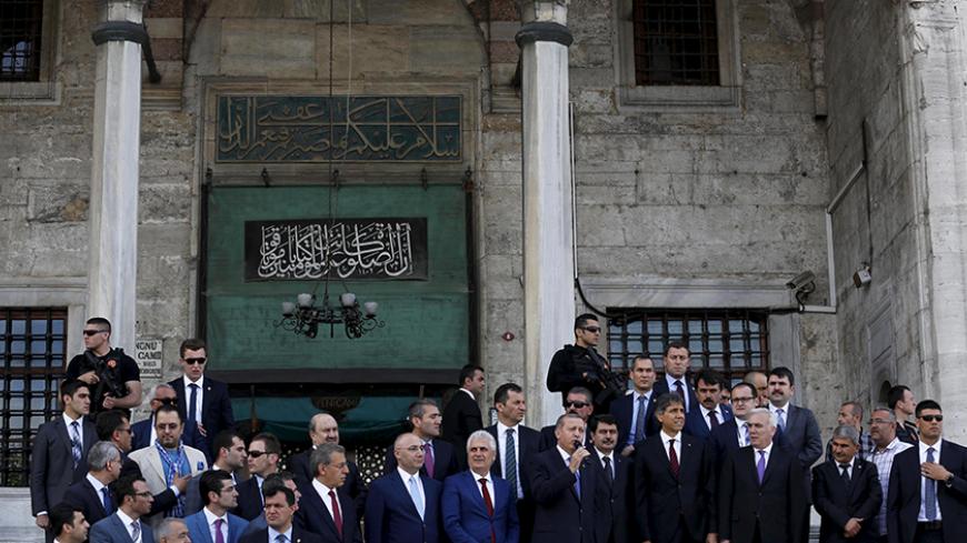 Turkey's President Tayyip Erdogan adressess his supporters in front of a mosque after Friday prayers in Istanbul, Turkey, May 29, 2015. Turkish President Tayyip Erdogan said the launch of Ziraat Bank's Islamic business should help to attract new funds to Turkey and urged other state lenders to help to triple Islamic banking's share of the market by 2023. Islamic finance has developed slowly in Turkey, the world's eighth most populous Muslim nation, partly because of political sensitivities and the secular n
