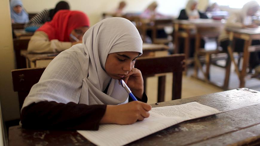 Students take an exam in one of the Al-Azhar institutes in Cairo, Egypt, May 20, 2015. Picture taken May 20, 2015. To match Special Report EGYPT-ISLAM/AZHAR    REUTERS/Asmaa Waguih  - RTR4Y73S