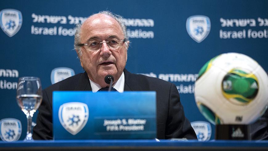 FIFA President Sepp Blatter speaks during a joint news conference with Avi Luzon, Israeli Football Association Chairman (not pictured), in Jerusalem July 9, 2013. Blatter will establish a task force to address Palestinian concerns over travel restrictions for soccer players and officials through border crossings controlled by Israel, he said on Tuesday. REUTER/Baz Ratner (JERUSALEM - Tags: POLITICS SPORT SOCCER) - RTX11HMA