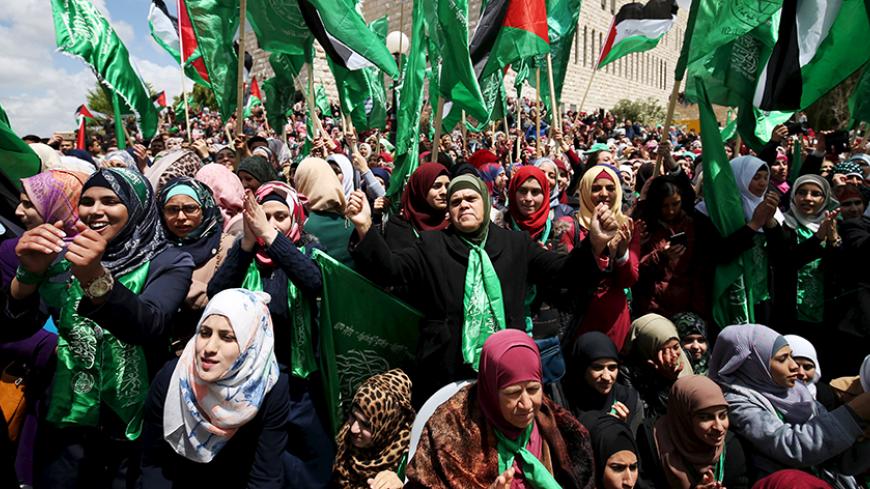 Palestinians supporting Hamas chant slogans during a rally celebrating Hamas student supporters winning the student council election at Birzeit University in the West Bank city of Ramallah April 23, 2015. REUTERS/Mohamad Torokman
 - RTX19YL4