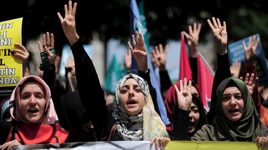 Pro-Islamist demonstrators shout slogans in favour of former President Mohamed Mursi during a protest in support of him at the courtyard of Fatih mosque in Istanbul, Turkey, May 17, 2015. An Egyptian court on Saturday sought the death penalty for former president Mohamed Mursi and 106 supporters of his Muslim Brotherhood in connection with a mass jail break in 2011. Mursi and his fellow defendants, including top Brotherhood leader Mohamed Badie, were convicted for killing and kidnapping policemen, attacking