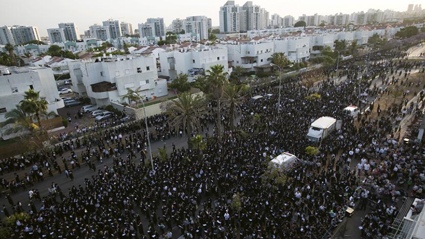 Ultra-Orthodox Jews take part in a protest against a shopping centre, which opens on Saturdays, near their neighbourhood, in the southern city of Ashdod May 18, 2015. About 10,000 protesters took part in the protest. REUTERS/Amir Cohen
 - RTX1DJBK