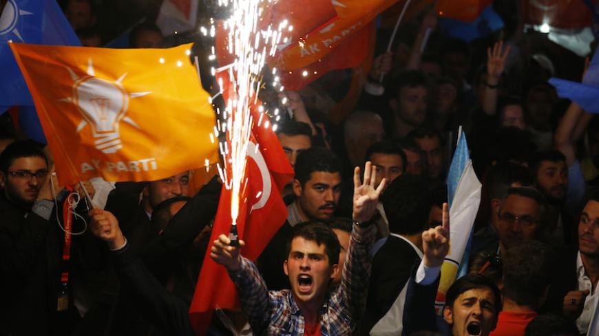 Supporters wave Turkish national and party flags as they shout slogans outside the AK Party headquarters in Ankara, Turkey, June 7, 2015. Turkish President Tayyip Erdogan's hopes of assuming greater powers suffered a serious blow on Sunday when the ruling AK Party failed to win an outright majority in a parliamentary election, partial results showed. With 94 percent of ballots counted, the AKP had taken 41 percent of the vote, according to broadcaster CNN Turk, a result which will leave it struggling to for