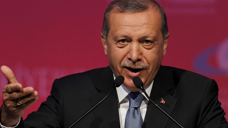 Turkey's President Tayyip Erdogan makes a speech during a graduation ceremony in Ankara, Turkey, June 11, 2015. President Erdogan on Thursday urged the country's political parties to work quickly to form a new government, saying egos should be left aside and that history would judge anyone who left Turkey in limbo. In his first public appearance since Sunday's parliamentary election, Erdogan said no political development should be allowed to threaten Turkey's gains. He said he would do his part in finding a