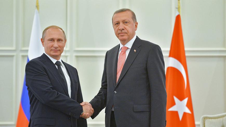 Russia's President Vladimir Putin (L) shakes hands with Turkey's President Tayyip Erdogan during their meeting in Baku, Azerbaijan, June 13, 2015.  REUTERS/Alexei Druzhinin/RIA Novosti/Kremlin ATTENTION EDITORS - THIS IMAGE HAS BEEN SUPPLIED BY A THIRD PARTY. IT IS DISTRIBUTED, EXACTLY AS RECEIVED BY REUTERS, AS A SERVICE TO CLIENTS. - RTX1GBHM