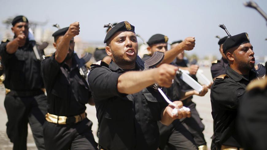 Palestinian policemen loyal to Hamas march during a military graduation ceremony in Gaza City June 16, 2015. REUTERS/Suhaib Salem



 - RTX1GOO1