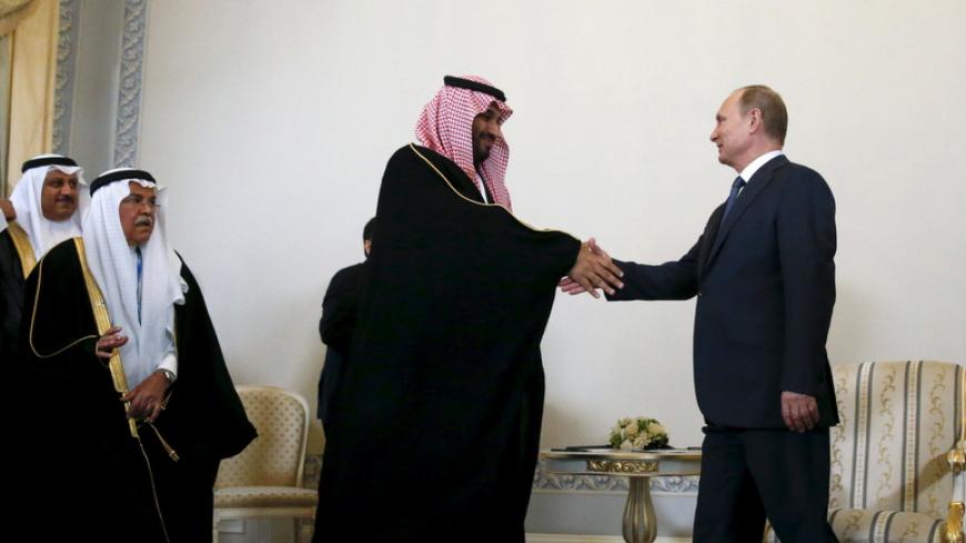 Russian President Vladimir Putin (R) shakes hands with Saudi Defence Minister Prince Mohammed Bin Salman (2nd R) during a meeting at the Konstantin (Konstantinovsky) Palace in St. Petersburg, Russia, June 18, 2015. REUTERS/Grigory Dukor  - RTX1H3KH