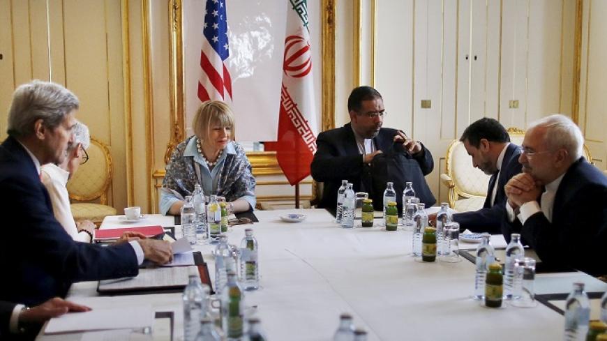 Iranian Foreign Minister Mohammad Javad Zarif (2nd R) meets with U.S. Secretary of State John Kerry (2nd L) at a hotel in Vienna, Austria June 27, 2015. Senior U.S. and Iranian officials said much hard work still needs to be done to bridge significant differences on an agreement to curb Iran's nuclear programme.   REUTERS/Carlos Barria - RTX1I13O