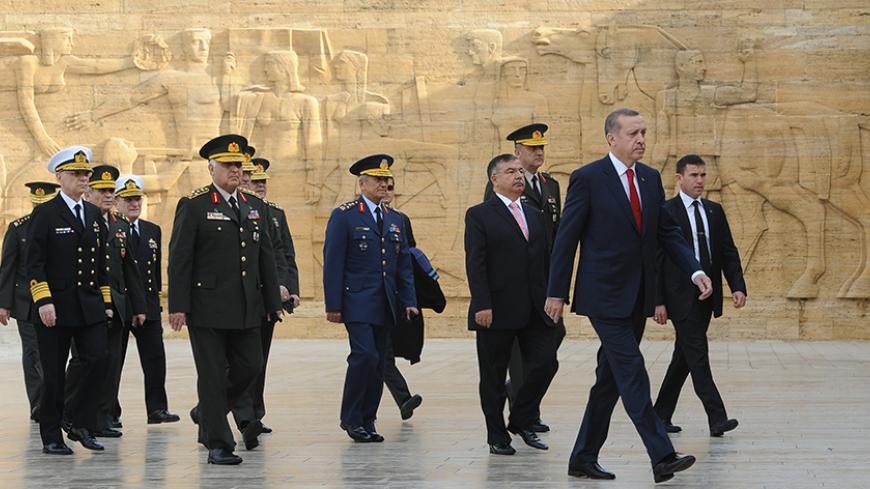 Turkey's Prime Minister Tayyip Erdogan (R) leaves after a wreath-laying ceremony with members of the Supreme Military Council at the mausoleum of Mustafa Kemal Ataturk, the founder of modern Turkey, in Ankara November 30, 2012. Erdogan will chair the twice-yearly meeting of the Supreme Military Council at army headquarters. REUTERS/Stringer (TURKEY - Tags: POLITICS MILITARY) - RTR3B1R8