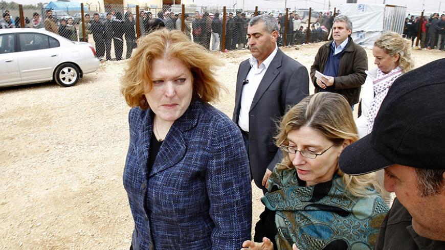 Anne C. Richard (L), assistant secretary of state for population, refugees, and migration, and Nancy Lindborg (front, 2nd R), USAID assistant administrator for democracy, conflict, and humanitarian assistance, visit the Al Zaatri Syrian refugee camp in the Jordanian city of Mafraq, near the border with Syria January 28, 2013.  REUTERS/Ali Jarekji (JORDAN - Tags: POLITICS CIVIL UNREST) - RTR3D2Y8