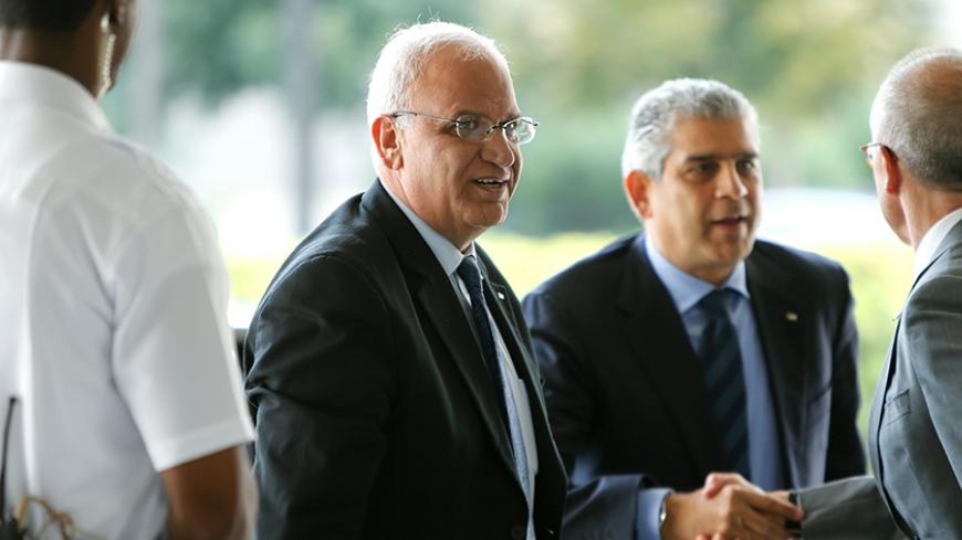 Palestinian Chief Negotiator Saeb Erekat (C) and Maen Rashid Areikat (2nd R), chief of the Palestine Liberation Organization (PLO) delegation in Washington, arrive to meet with U.S. Secretary of State John Kerry at the State Department in Washington September 3, 2014.  REUTERS/Jonathan Ernst    (UNITED STATES - Tags: POLITICS CIVIL UNREST) - RTR44TZ1