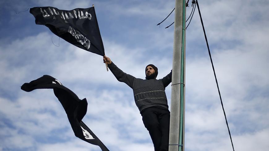 Palestinian Salafists wave flags during a protest against satirical French weekly magazine Charlie Hebdo's cartoons of the Prophet Mohammad, outside the French Cultural Centre in Gaza city January 19, 2015. Dozens of Jihadist Salafi men rallied in Gaza on Monday to condemn continued publication by French satirical magazine Charlie Hebdo of cartoons deemed offensive to Islam's Prophet. Charlie Hebdo published a picture of Mohammad weeping on its cover last week after gunmen stormed its offices in Paris, kill