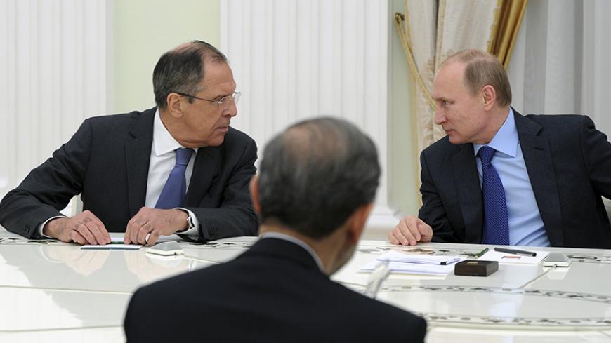 Russia's President Vladimir Putin (R) and Foreign Minister Sergei Lavrov (L) attend a meeting with Ali Akbar Velayati, a special envoy of the Iranian president, at the Kremlin in Moscow January 28, 2015. Putin, along with Energy Minister Alexander Novak and Lavrov, met with the envoy of Iranian President Hassan Rouhani, the Kremlin said in a statement on Wednesday. The Kremlin statement said bilateral relations along with global and regional issues were discussed at the meeting. REUTERS/Mikhail Klimentyev/R