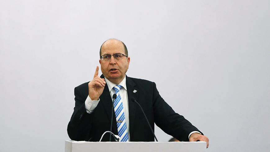 Israeli Defence Minister Moshe Ya'alon gestures while addressing a gathering during a lecture themed "Israel-India Partnership in the 21st Century"?, in New Delhi February 19, 2015. Ya'alon arrived in India on Wednesday to help sell his country's arms industry to the world's largest defence importer and promote deepening military ties between the two nations. REUTERS/Adnan Abidi (INDIA - Tags: MILITARY POLITICS BUSINESS) - RTR4Q7TL