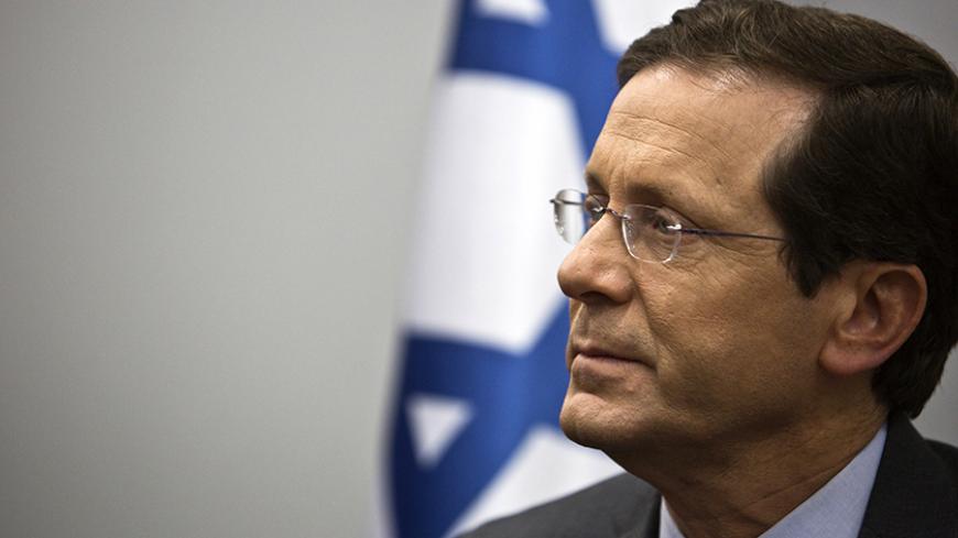 Isaac Herzog, co-leader of the centre-left Zionist Union party, is seen at his party's headquarters in Tel Aviv March 16, 2015. Israel's Prime Minister Benjamin Netanyahu, in a final bid to shore up right-wing support ahead of a knife-edge vote on Tuesday, said he would not permit a Palestinian state to be created under his watch if he is re-elected. Herzog favors reviving peace talks with U.S.-backed Palestinian President Mahmoud Abbas. REUTERS/Nir Elias (ISRAEL - Tags: POLITICS ELECTIONS) - RTR4TKZ6