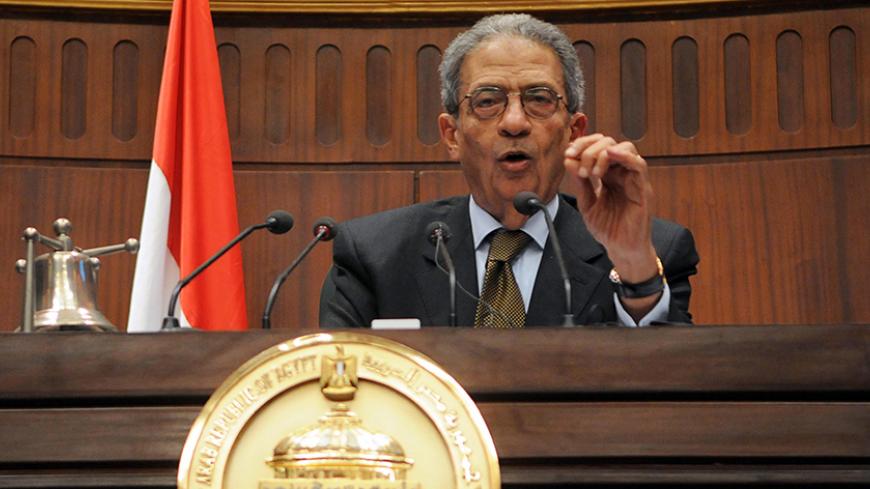 Amr Moussa, head of the assembly writing Egypt's new constitution,speaks after they finished their vote at the Shura Council in Cairo December 1, 2013. A hardline Islamist leader said the army had driven Egypt to the "edge of a precipice", as a new constitution likely to ban Islamic political parties was set to be approved on Sunday by the panel that drafted it. The 50-member constituent assembly was due to finish voting on a draft that reflects how the balance of power has shifted in Egypt since secular-mi