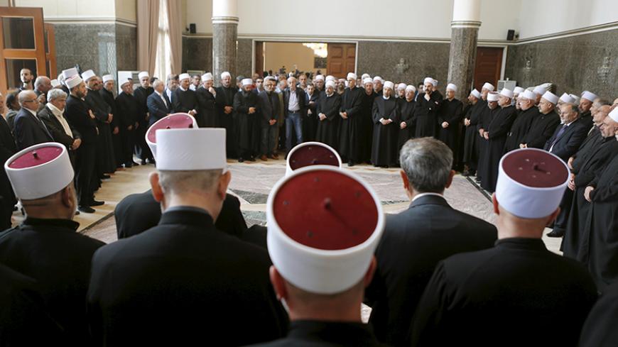 Lebanon's Druze leader Walid Jumblatt (C) stands during a meeting of Druze spiritual figures in Beirut, Lebanon June 12, 2015. Members of Syria's Druze minority have helped repel a rebel attack on an army base in the south, mobilizing to confront insurgents including al Qaeda's Nusra Front who are trying to build on gains against President Bashar al-Assad. Some Druze leaders have warned of an existential threat facing their kin after Nusra Front fighters shot dead 20 people in a Druze village in northwester