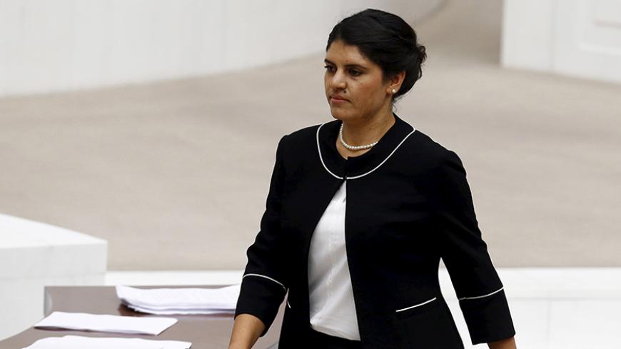 Lawmaker of the pro-Kurdish Peoples' Democratic Party (HDP) Dilek Ocalan, niece of jailed Kurdistan Workers' Party (PKK) leader Abdullah Ocalan, returns to her seat after taking her oath at the Turkish parliament in Ankara, Turkey, June 23, 2015. For many Turks, the name Ocalan is indelibly linked to the man they revile as leader of a Kurdish insurgency in which 40,000 people died. But on Tuesday, an Ocalan became one of the country's youngest parliamentarians. Dilek, the 28-year-old niece of jailed militan