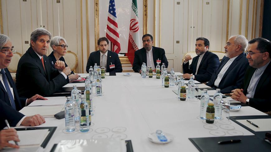U.S. Secretary of Energy Ernest Moniz, U.S. Secretary of State John Kerry and U.S. Under Secretary for Political Affairs Wendy Sherman (L-3rd L) meet with Iranian Foreign Minister Mohammad Javad Zarif (2nd R) at a hotel in Vienna, Austria June 28, 2015. Kerry is joining negotiations from six powers and Iran seeking an agreement under which Tehran would curb its nuclear program in exchange for relief from economic sanctions that have crippled its economy.  REUTERS/Carlos Barria - RTX1I3WB