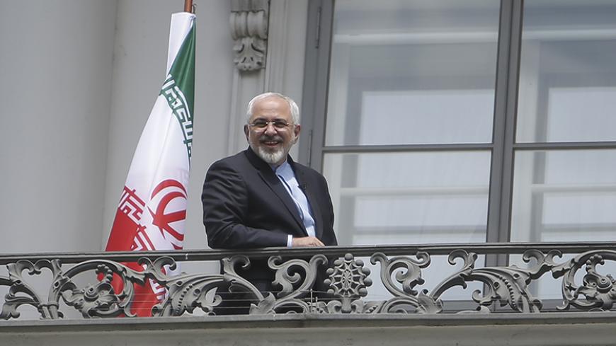 Iranian Foreign Minister Javad Zarif stands on the balcony of Palais Coburg, the venue for nuclear talks in Vienna, Austria, July 2, 2015. Iran and six world powers gave themselves an extra week to reach a final nuclear accord after it became clear they would miss a deadline on Tuesday, with U.S. and Iranian officials sounding upbeat even though obstacles remain.
  REUTERS/Leonhard Foeger - RTX1IPX5
