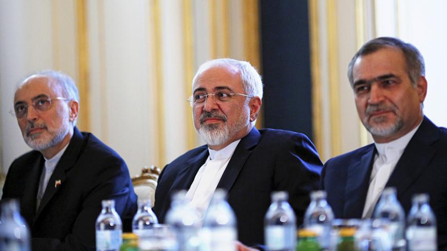 Iranian Foreign Minister Mohammad Javad Zarif (C), Head of the Iranian Atomic Energy Organization Ali Akbar Salehi and Hossein Fereydoon (R), brother and close aide to President Hassan Rouhani meet with U.S. Secretary of State John Kerry (not pictured) at a hotel in Vienna, Austria July 3, 2015. A year and half of nuclear talks between Iran and major powers were creeping towards the finish line on Friday as negotiators wrestled with sticking points including questions about Tehran's past atomic research.  R