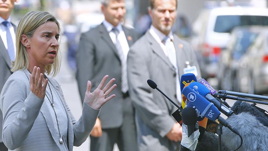 European Union foreign policy chief Federica Mogherini talks to journalists outside Palais Coburg, the venue for nuclear talks in Vienna, Austria, July 7, 2015. Iran and major powers will continue negotiations on an historic nuclear deal past a deadline for a long-term agreement, which is set to expire later on Tuesday, Mogherini said. "We are continuing to negotiate for the next couple of days. This does not mean we are extending our deadline," Mogherini told reporters. REUTERS/Leonhard Foeger - RTX1JDO3