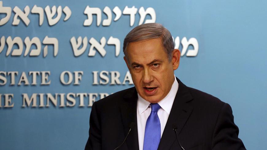 Israel's Prime Minister Benjamin Netanyahu speaks during a news conference in Jerusalem July 14, 2015. Netanyahu said on Tuesday Israel would not be bound by the nuclear deal between world powers and Iran and would defend itself. REUTERS/Ammar Awad  - RTX1KA98